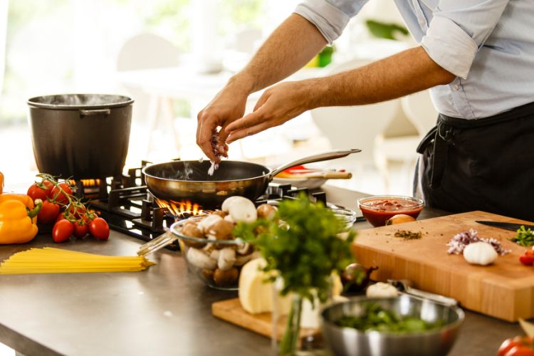 A man cooking in the kitchen